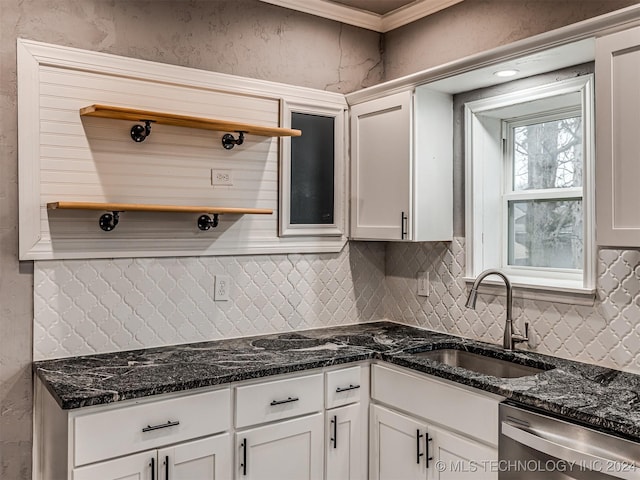 kitchen with sink, white cabinets, and stainless steel dishwasher