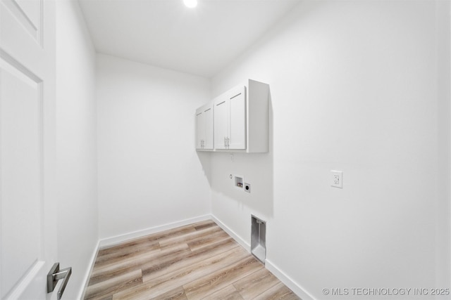 clothes washing area featuring cabinet space, light wood-type flooring, baseboards, and washer hookup