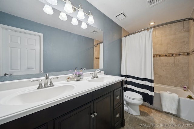 full bathroom featuring vanity, toilet, and shower / bathtub combination with curtain