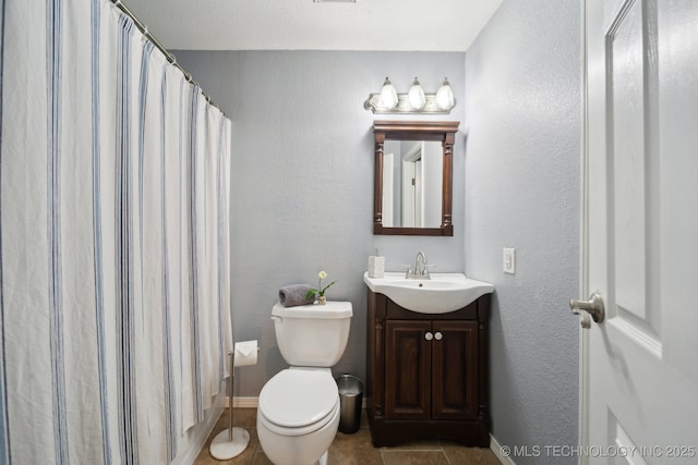 bathroom featuring tile patterned flooring, vanity, toilet, and a shower with shower curtain