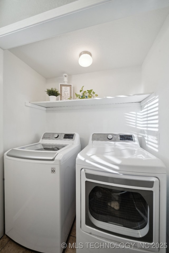 laundry room featuring washer and clothes dryer