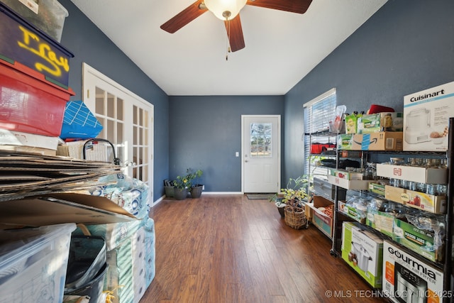 miscellaneous room with ceiling fan and dark wood-type flooring