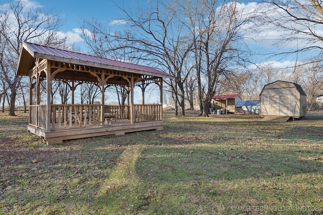 view of yard with a gazebo and a storage unit