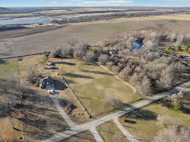 aerial view with a rural view and a water view