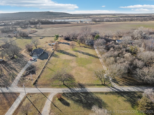 drone / aerial view featuring a mountain view and a rural view