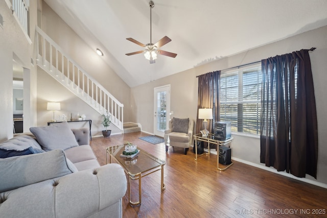 living room featuring hardwood / wood-style flooring, high vaulted ceiling, and ceiling fan