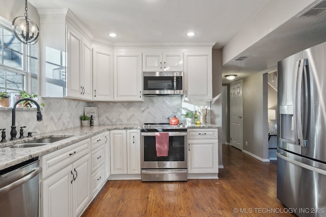 kitchen with white cabinets, sink, and appliances with stainless steel finishes