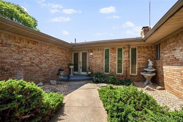 entrance to property featuring french doors