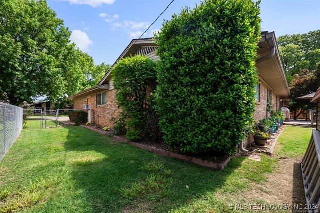 view of property exterior featuring a yard