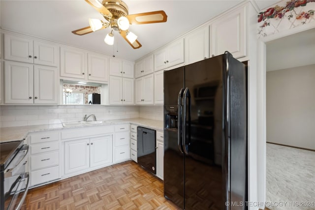 kitchen featuring ceiling fan, light parquet flooring, black appliances, sink, and white cabinetry