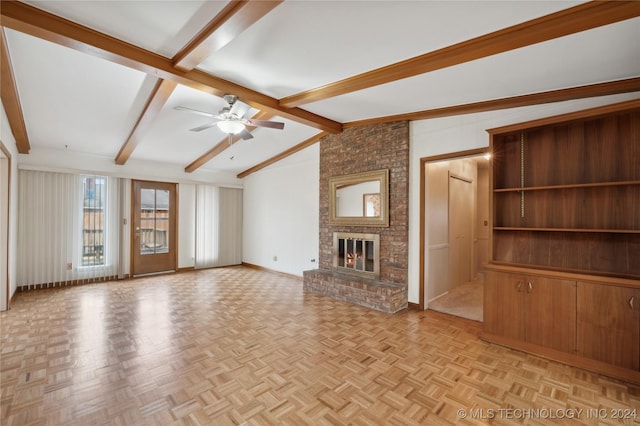 unfurnished living room with ceiling fan, light parquet flooring, a brick fireplace, and vaulted ceiling with beams