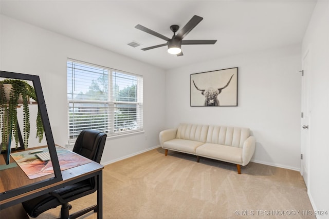 carpeted office with ceiling fan