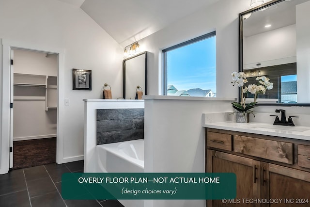 bathroom featuring a tub, tile patterned flooring, vanity, and lofted ceiling