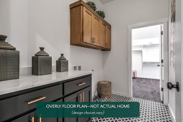 washroom featuring cabinets, washer hookup, electric dryer hookup, and carpet