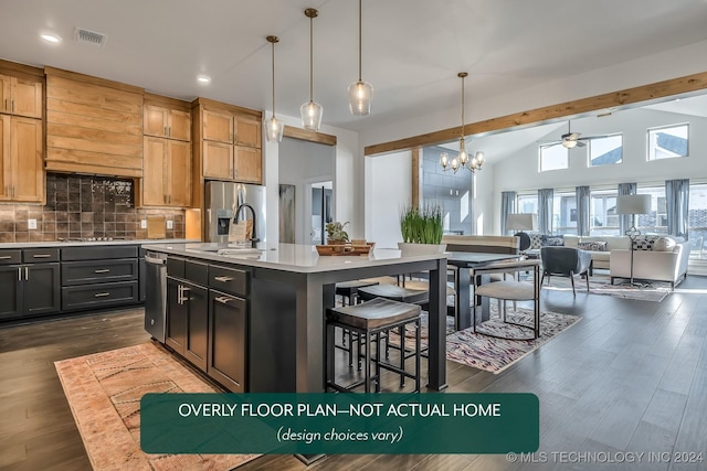 kitchen featuring tasteful backsplash, vaulted ceiling with beams, pendant lighting, a center island with sink, and ceiling fan with notable chandelier