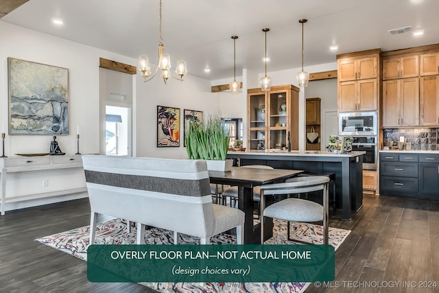 kitchen featuring decorative backsplash, stainless steel appliances, dark wood-type flooring, pendant lighting, and a kitchen island