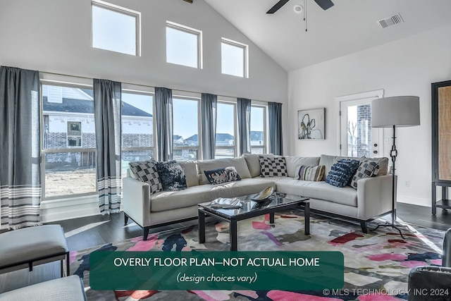 living room with a wealth of natural light, ceiling fan, dark wood-type flooring, and high vaulted ceiling