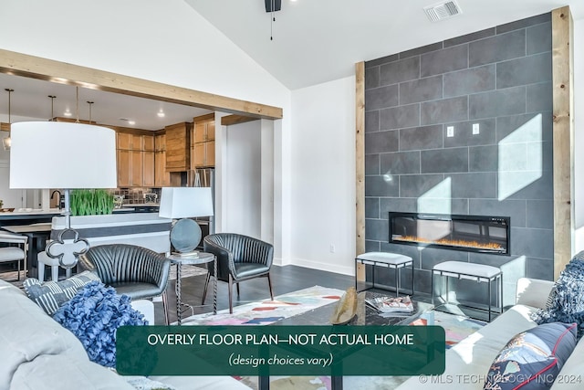 living room with a fireplace, high vaulted ceiling, and sink