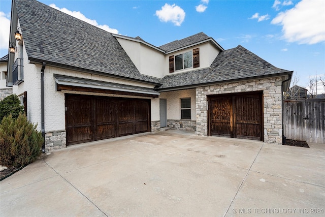 french country home with a garage