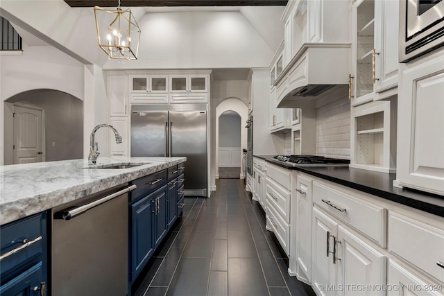 kitchen featuring white cabinetry, sink, appliances with stainless steel finishes, and blue cabinets