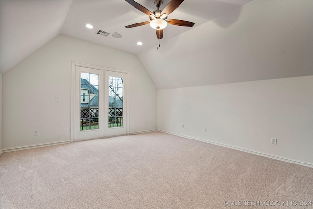 bonus room featuring ceiling fan, lofted ceiling, and light carpet