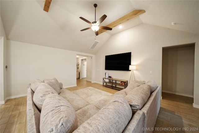 living room featuring ceiling fan, lofted ceiling, and light wood-type flooring