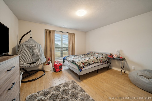 bedroom with light wood-type flooring