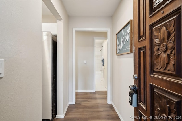 corridor featuring dark wood-type flooring