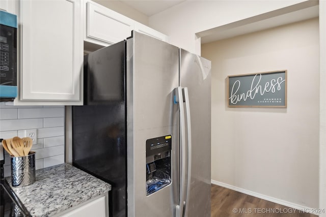 kitchen with light stone counters, white cabinetry, appliances with stainless steel finishes, and tasteful backsplash