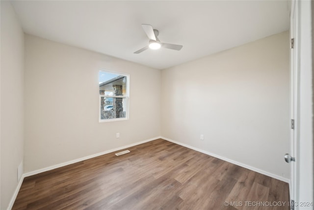 spare room with ceiling fan and hardwood / wood-style floors