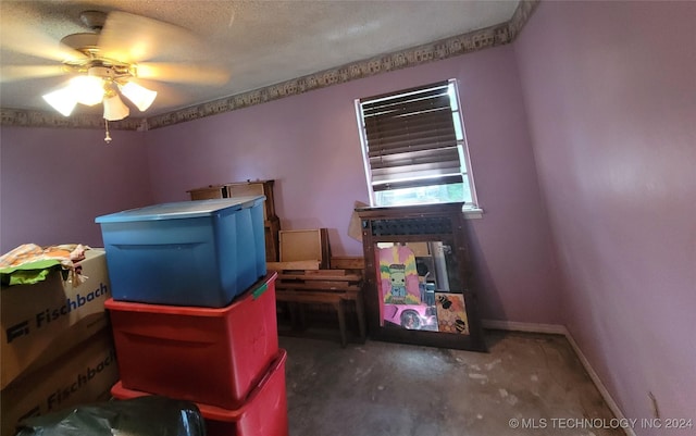 interior space featuring ceiling fan