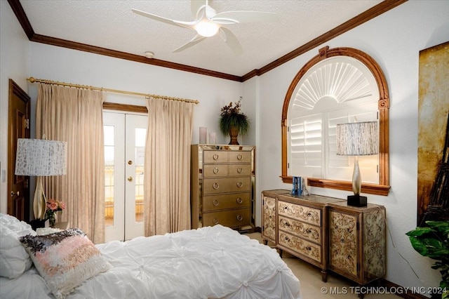 bedroom featuring a textured ceiling, ceiling fan, and crown molding