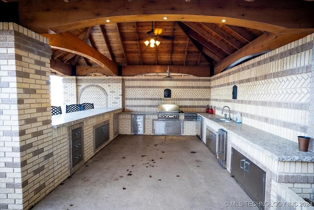 view of patio / terrace with area for grilling and sink