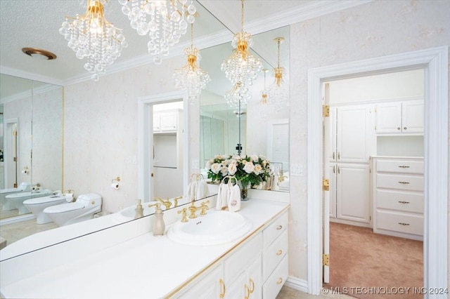 bathroom with a chandelier, toilet, a bidet, and ornamental molding