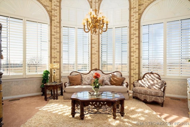 sunroom with a notable chandelier