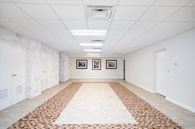 basement with a drop ceiling