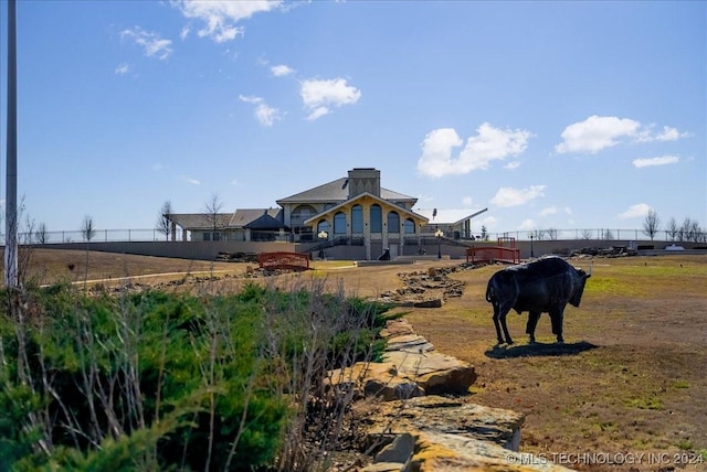 rear view of property with a rural view