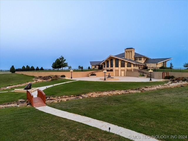 exterior space featuring a lawn and a patio