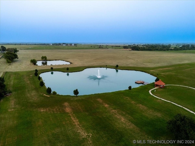 exterior space with a water view and a rural view