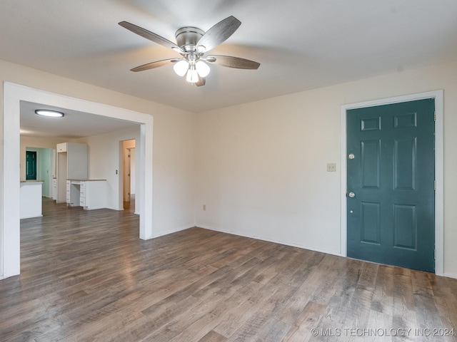 spare room featuring ceiling fan and hardwood / wood-style floors