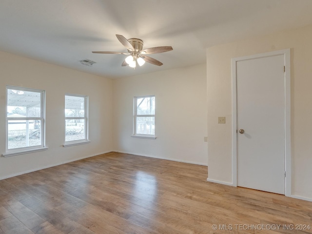 unfurnished room with ceiling fan and light hardwood / wood-style flooring