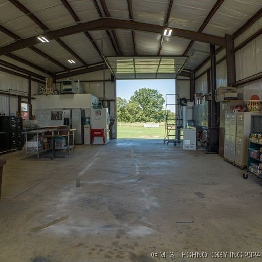 garage featuring stainless steel fridge