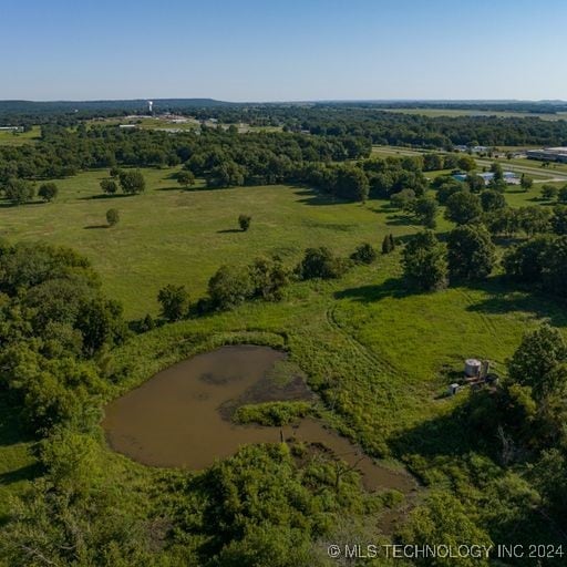 aerial view with a rural view and a water view