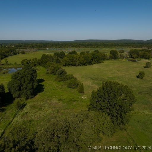 birds eye view of property with a rural view and a water view