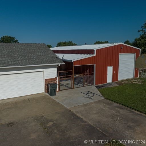 garage featuring a yard