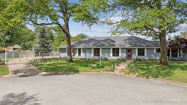 single story home featuring a front yard