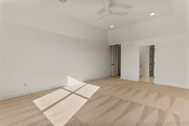 empty room featuring ceiling fan and light colored carpet