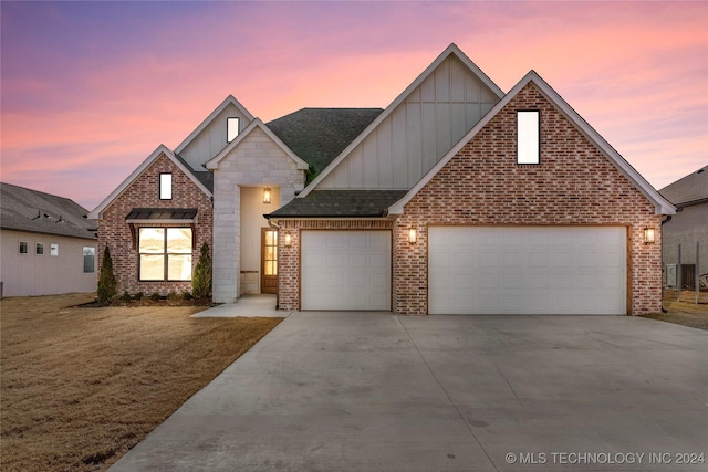 view of front facade featuring a yard and a garage