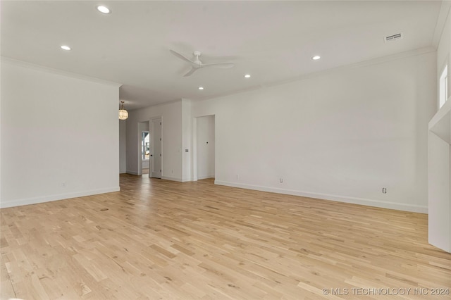 unfurnished room with light hardwood / wood-style flooring, ceiling fan, and crown molding