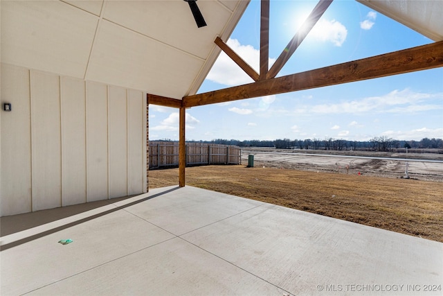 view of patio featuring ceiling fan and a rural view